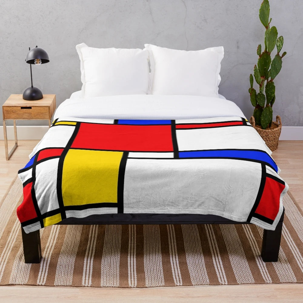 Mondrian-inspired plush blanket with bold primary colors and geometric patterns