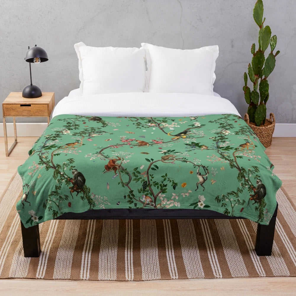 Monkey World Green Plush Blanket featuring a lush floral and botanical design