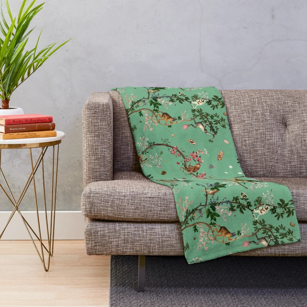 Monkey World Green Plush Blanket featuring a lush floral and botanical design