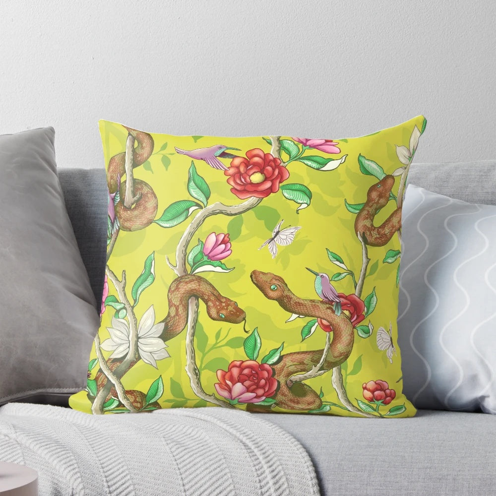 Colorful mustard-colored pillow with a vibrant floral and snake pattern, perfect for adding a touch of nature to your home.