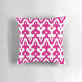 Fuchsia pink and white damask-patterned throw pillow with Moroccan, ikat, and arabesque design elements.