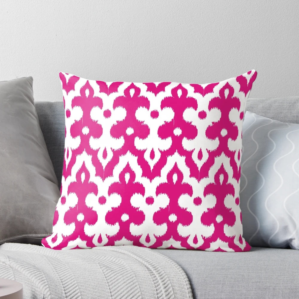 Fuchsia pink and white damask-patterned throw pillow with Moroccan, ikat, and arabesque design elements.