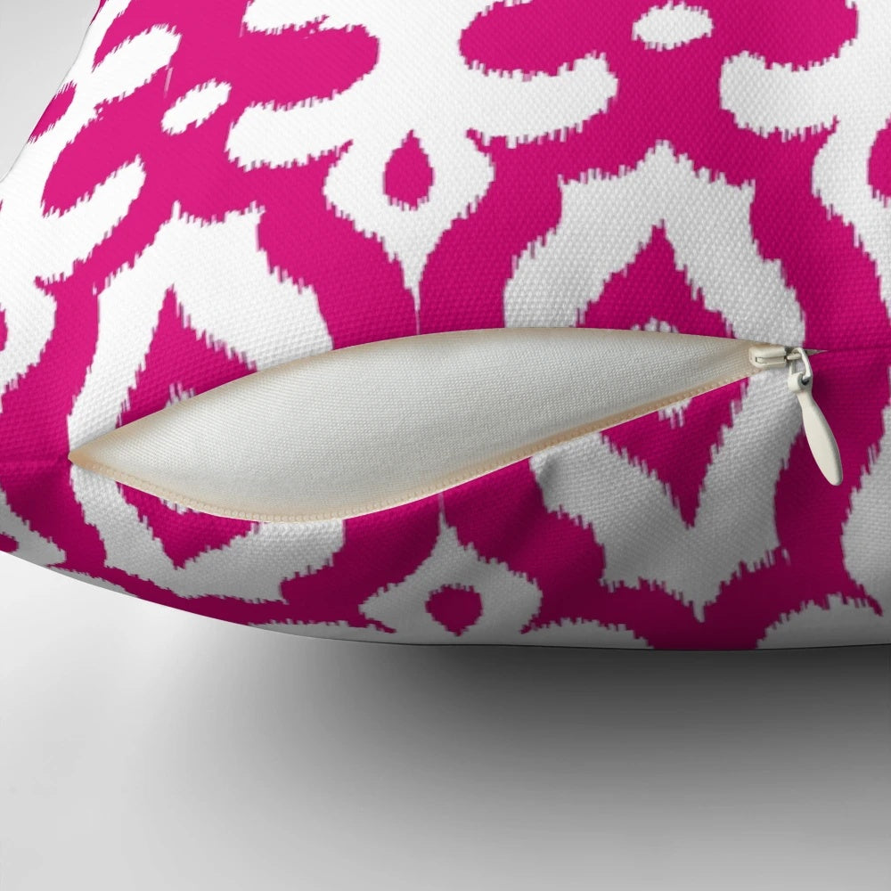 Fuchsia pink and white damask-patterned throw pillow with Moroccan, ikat, and arabesque design elements.