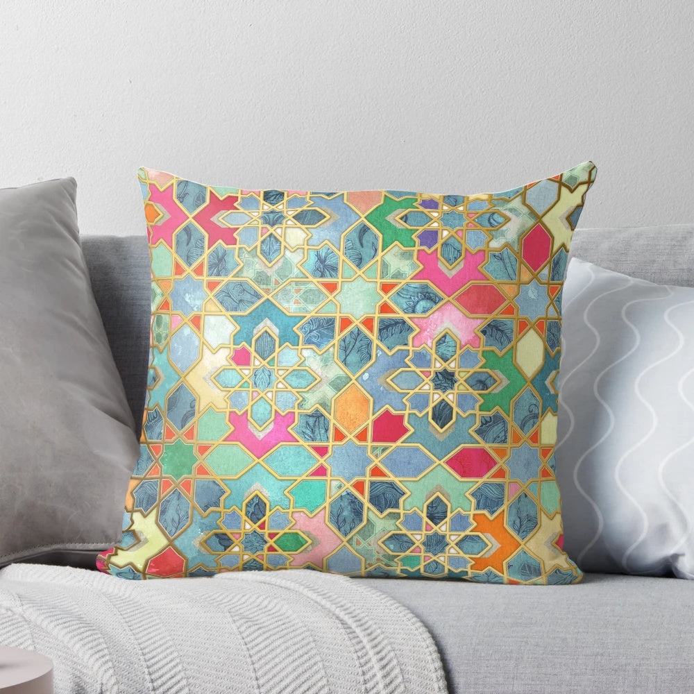Colorful Moroccan-style mosaic pattern pillow in various shades of blue, pink, orange, and gold.