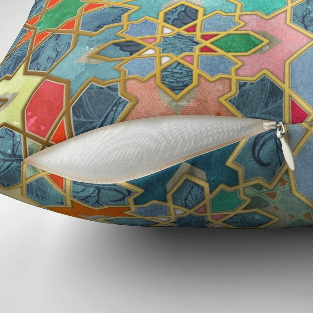 Colorful Moroccan-style mosaic pattern pillow in various shades of blue, pink, orange, and gold.