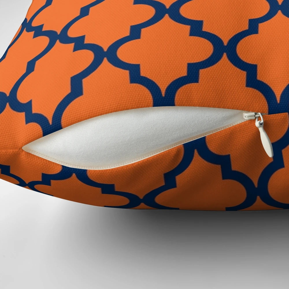 Moroccan-inspired orange and navy blue patterned pillow