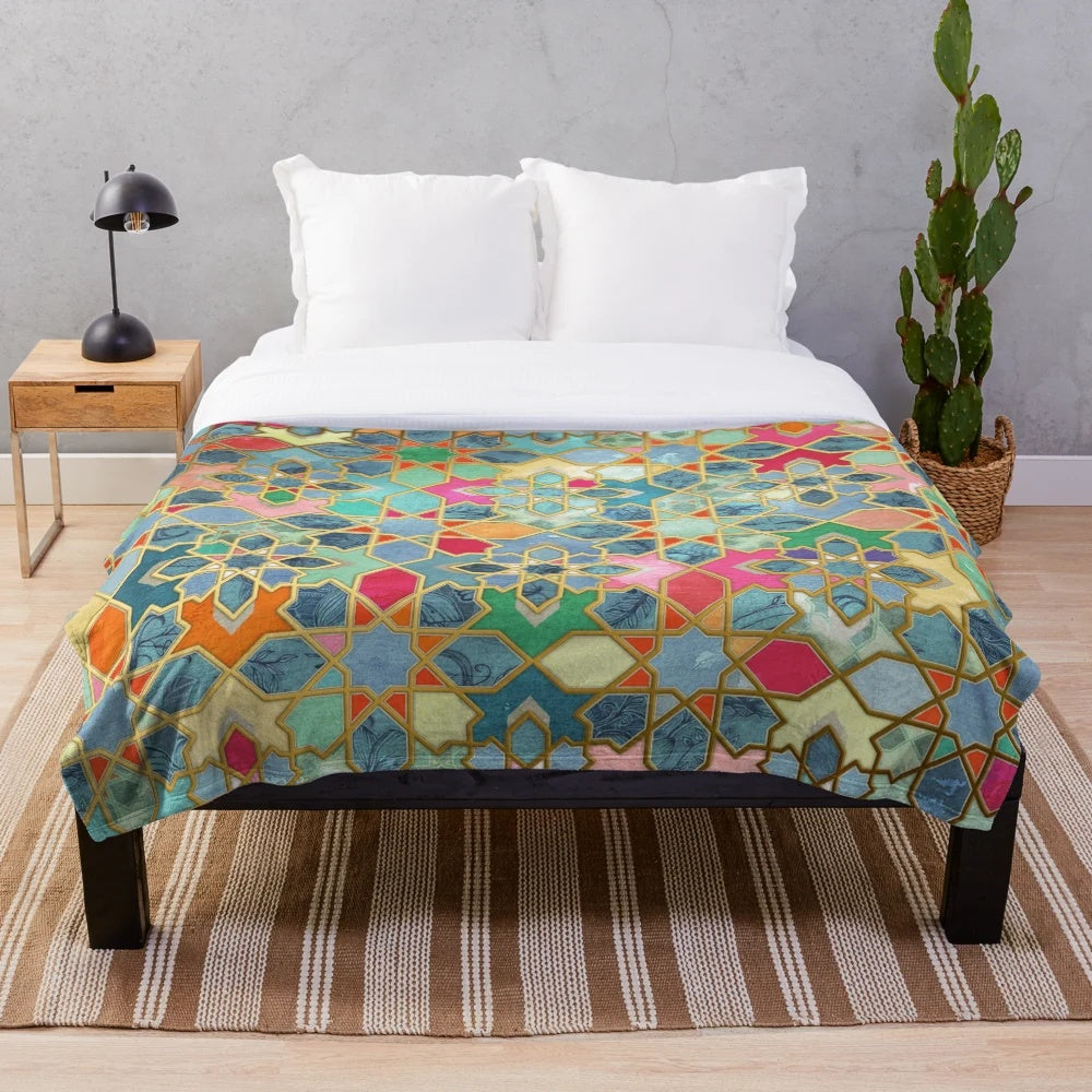 Colorful geometric pattern plush blanket with Moroccan-inspired stained glass tile design