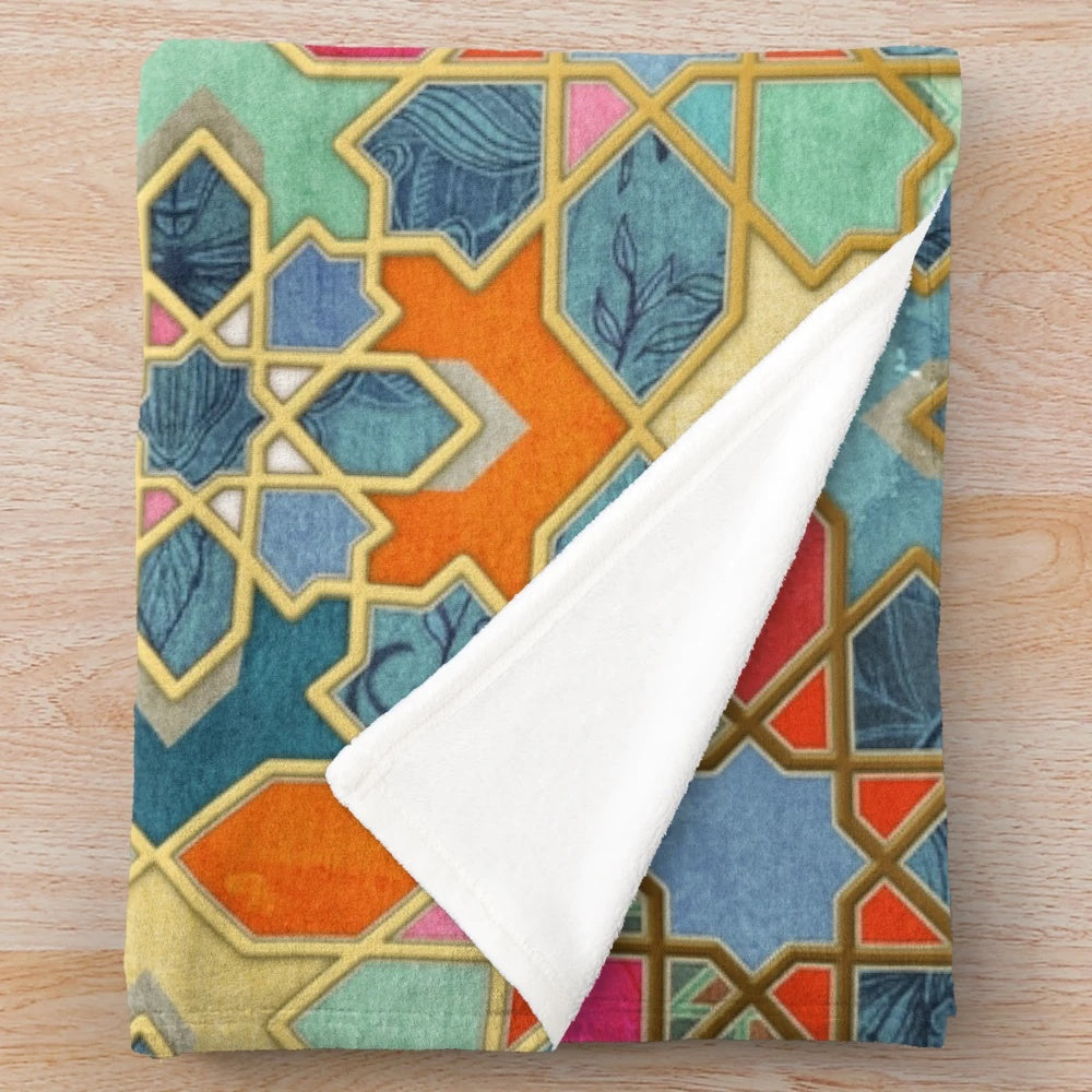Colorful geometric pattern plush blanket with Moroccan-inspired stained glass tile design