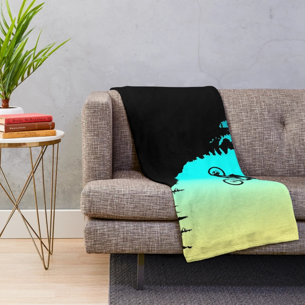 Colorful plush blanket featuring mountain bike design