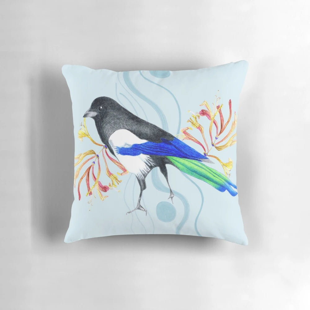 Colorful and realistic pillow design featuring a vibrant, multicolored bird in a natural setting.