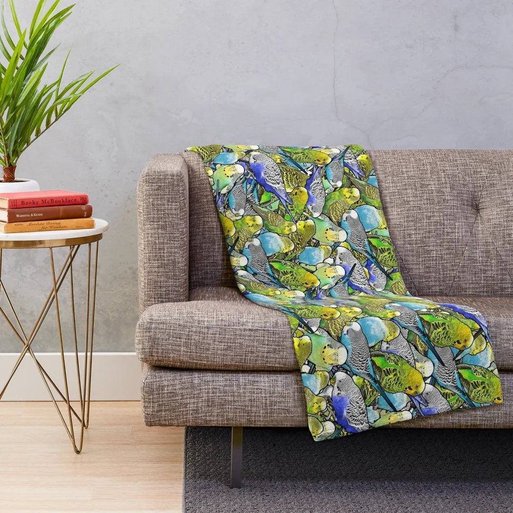 Multicolored plush blanket featuring a colorful budgie pattern design