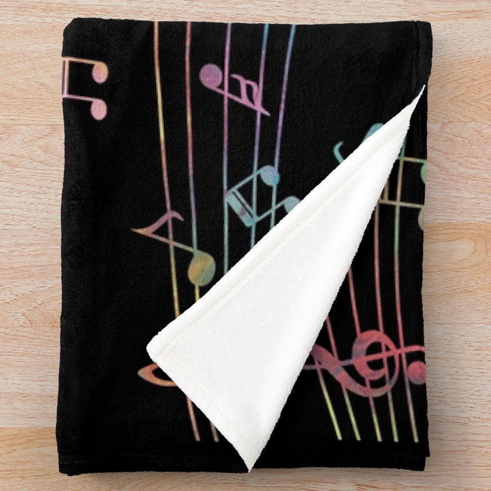 Colorful plush musical blanket with watercolor-style music notes