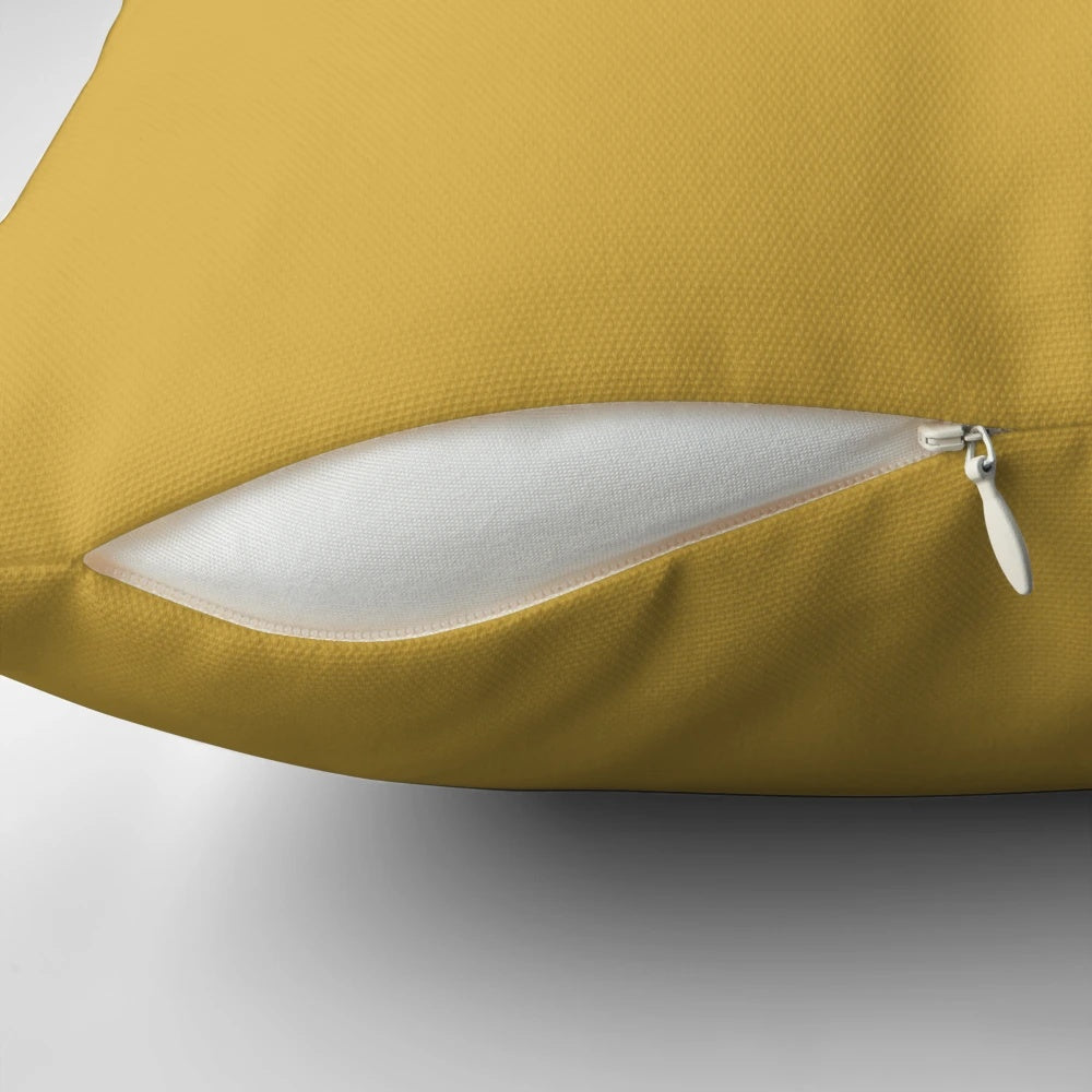 Mustard yellow decorative throw pillow with a vibrant, modern color and pattern