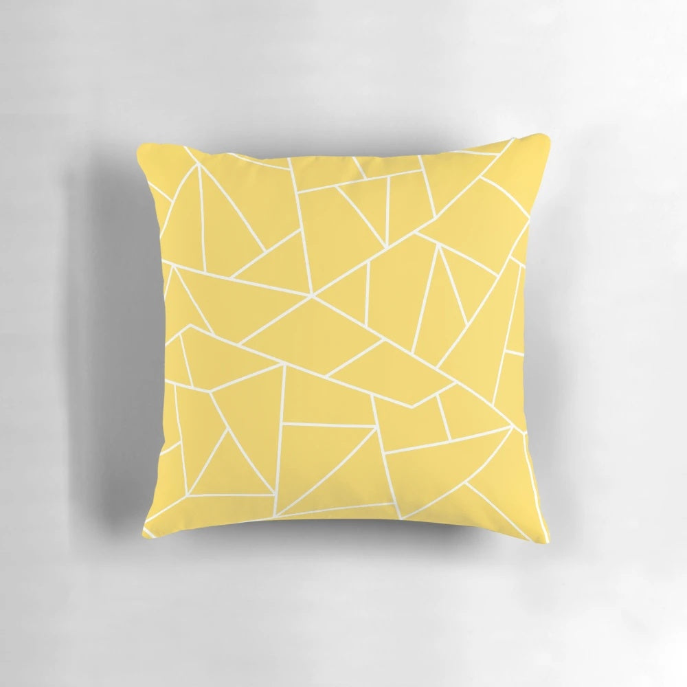 Mustard yellow and white pillow with abstract geometric lines and mosaic pattern design