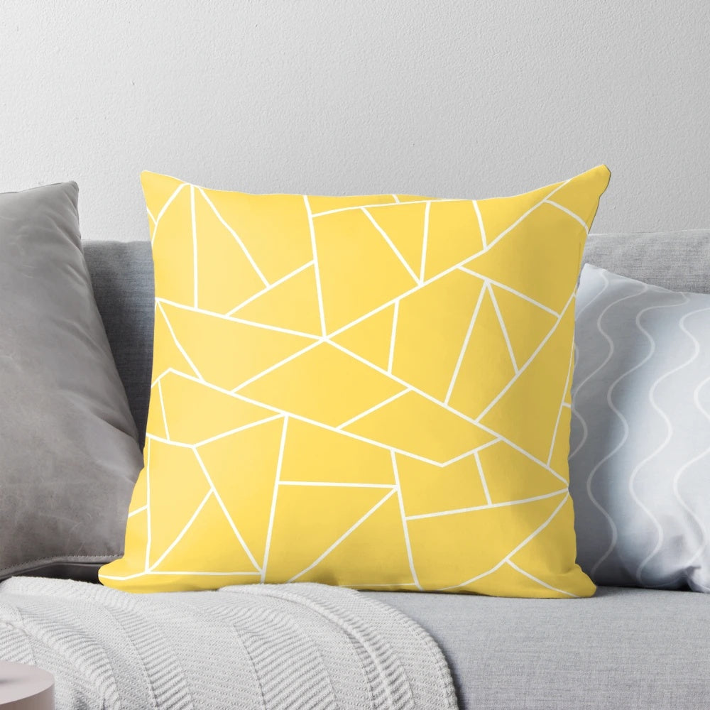 Mustard yellow and white pillow with abstract geometric lines and mosaic pattern design