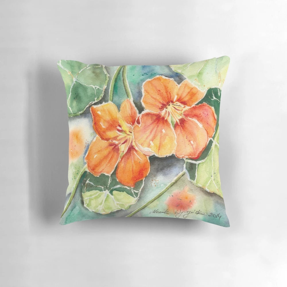 Closeup of a watercolor painting of orange nasturtium flowers on a decorative pillow.