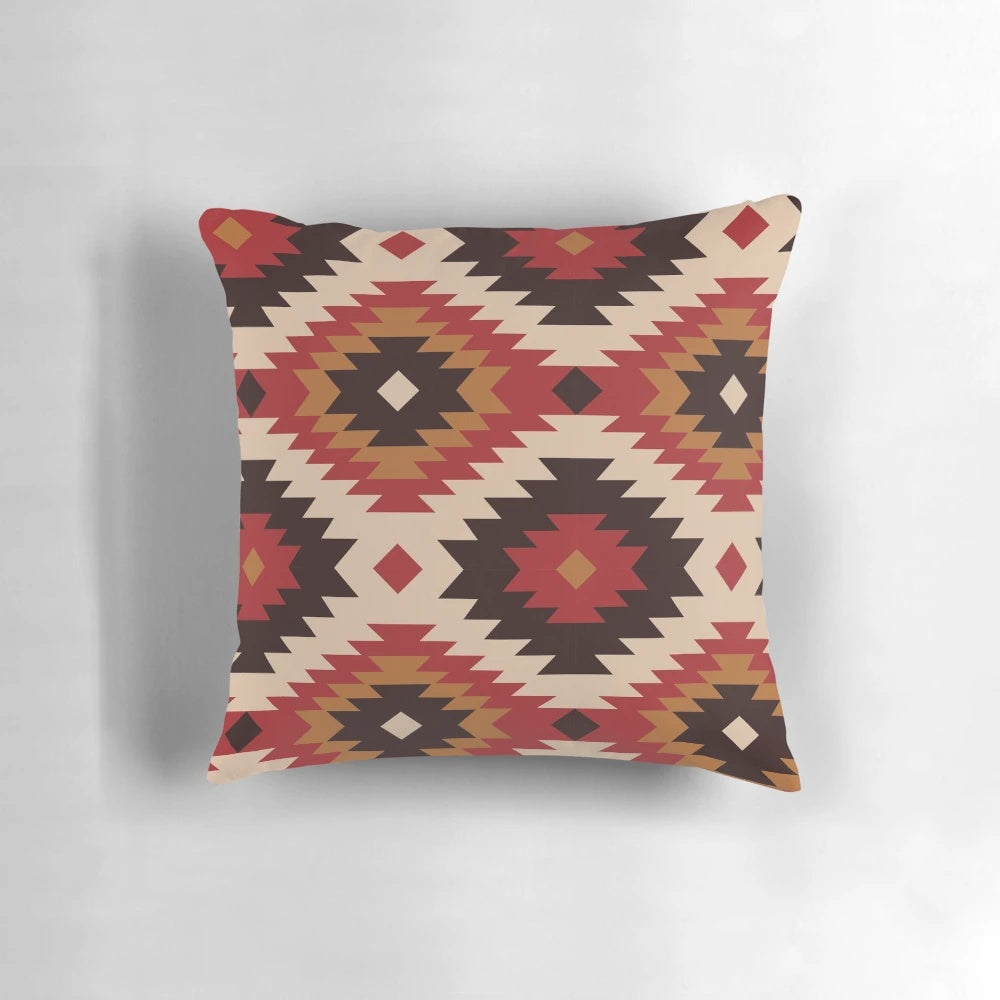 Navajo-inspired pillow in red and mustard colors with ethnic, tribal patterns