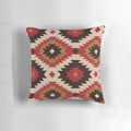 Navajo-inspired pillow in red and mustard colors with ethnic, tribal patterns