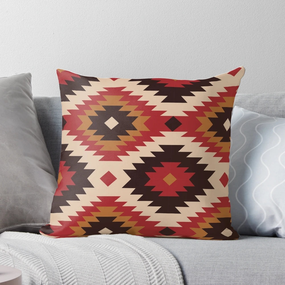 Navajo-inspired pillow in red and mustard colors with ethnic, tribal patterns