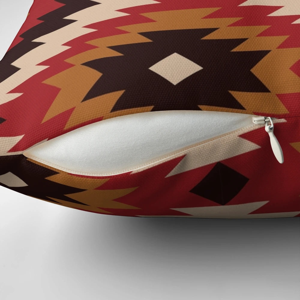 Navajo-inspired pillow in red and mustard colors with ethnic, tribal patterns
