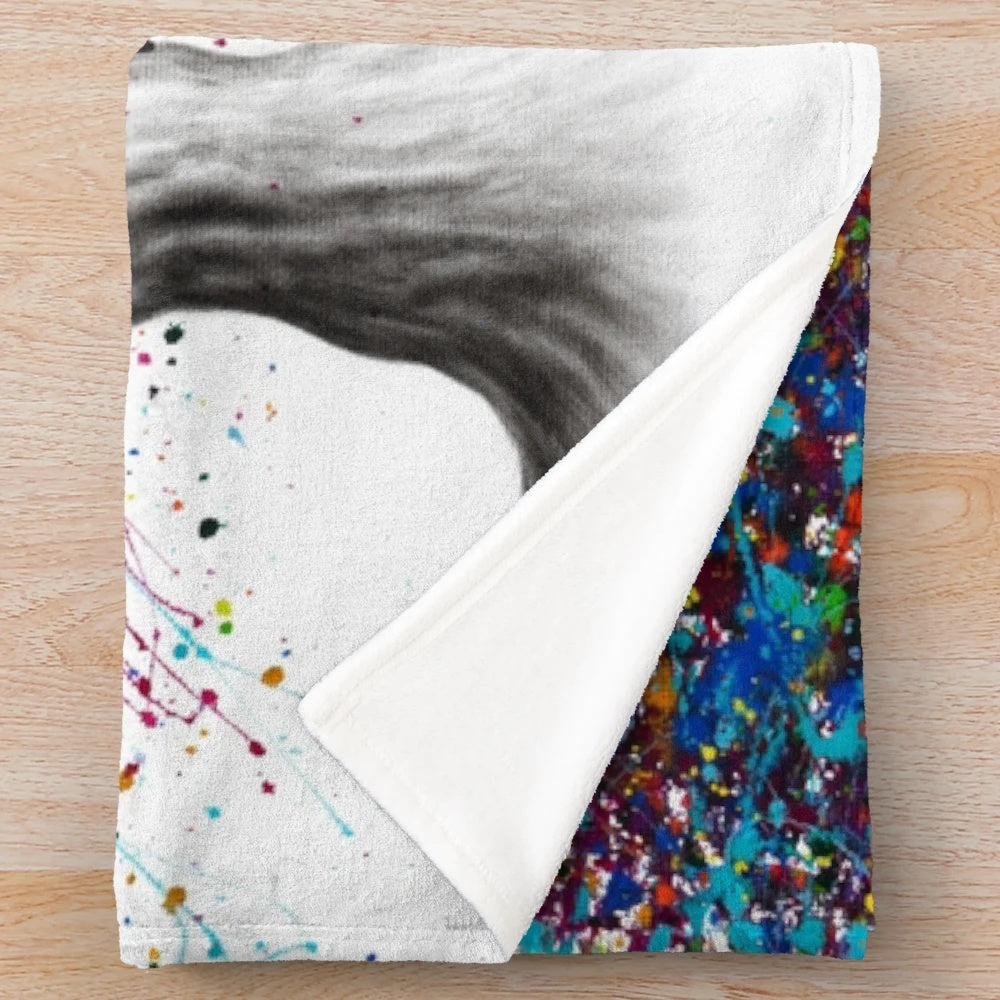 Colorful and whimsical plush blanket featuring an expressionist nature-inspired design