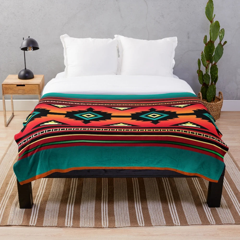 Navajo-inspired plush blanket with vibrant geometric patterns and teal border