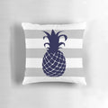 Navy blue and silver gray striped pillow with a bright pineapple design, perfect for tropical or coastal home decor