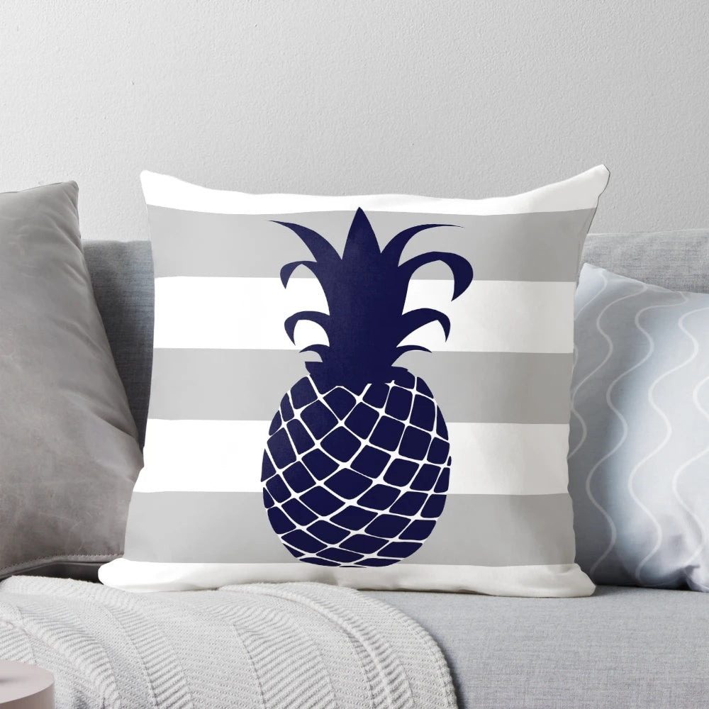 Navy blue and silver gray striped pillow with a bright pineapple design, perfect for tropical or coastal home decor