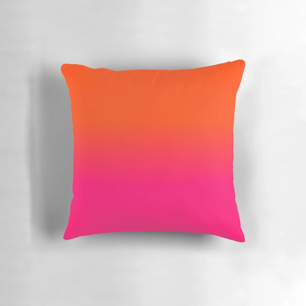 Neon orange and pink ombre fade throw pillow with a bright, modern color design