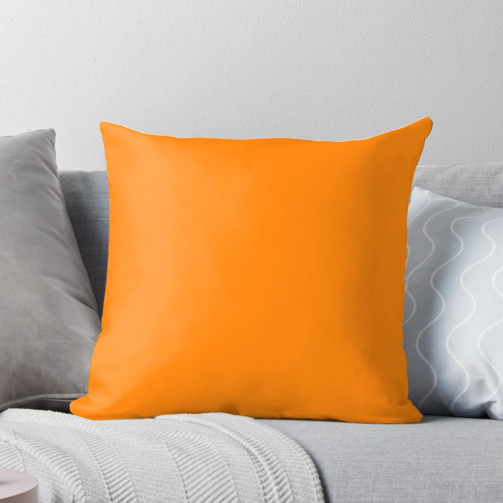 Bright neon orange pillow, perfect for adding a pop of color to your home decor.