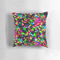 Neon paint splatter blacklight pillow with a vibrant, trippy design