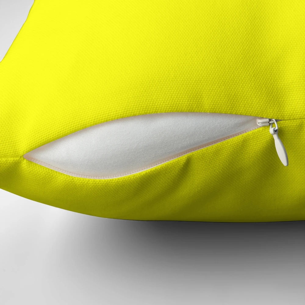 Neon yellow decorative throw pillow with a solid, minimalist design