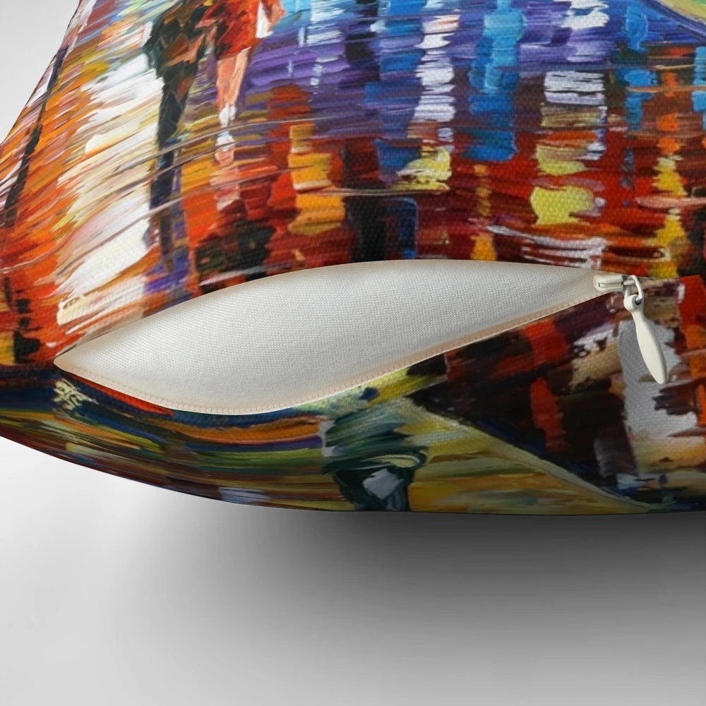 Pillow showcasing Leonid Afremov's vibrant painting of a rainy night city street scene with colorful lights and figures.