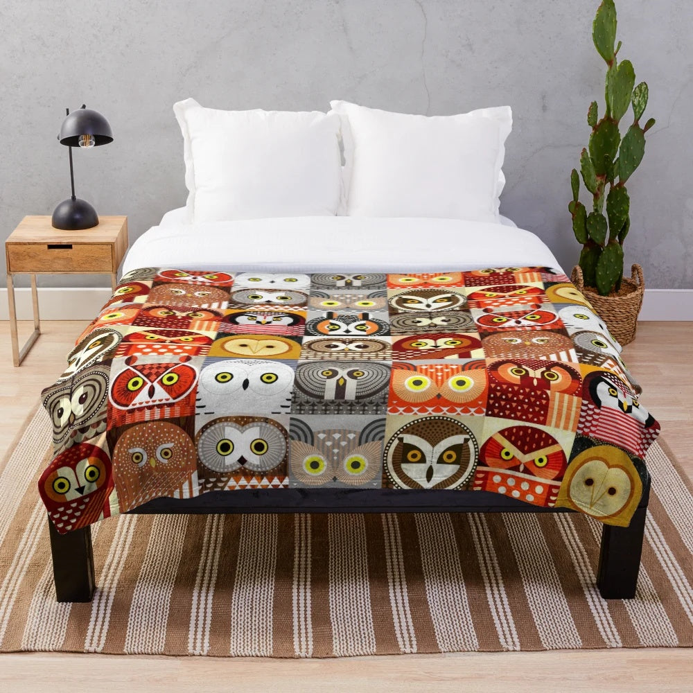 Colorful and geometric plush blanket featuring illustrations of North American owls