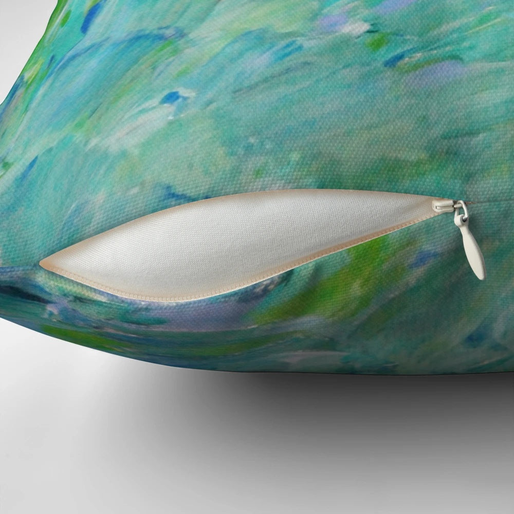 Decorative pillow featuring an abstract design with peacock feathers, mermaid fins, and ocean waves in shades of teal, navy, and avocado green.