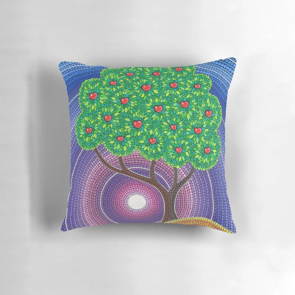 Colorful decorative throw pillow featuring an apple tree art design in autumnal hues
