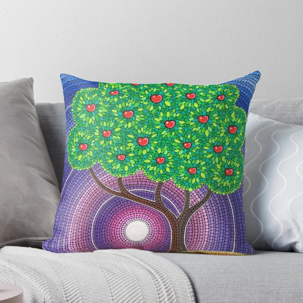 Colorful decorative throw pillow featuring an apple tree art design in autumnal hues