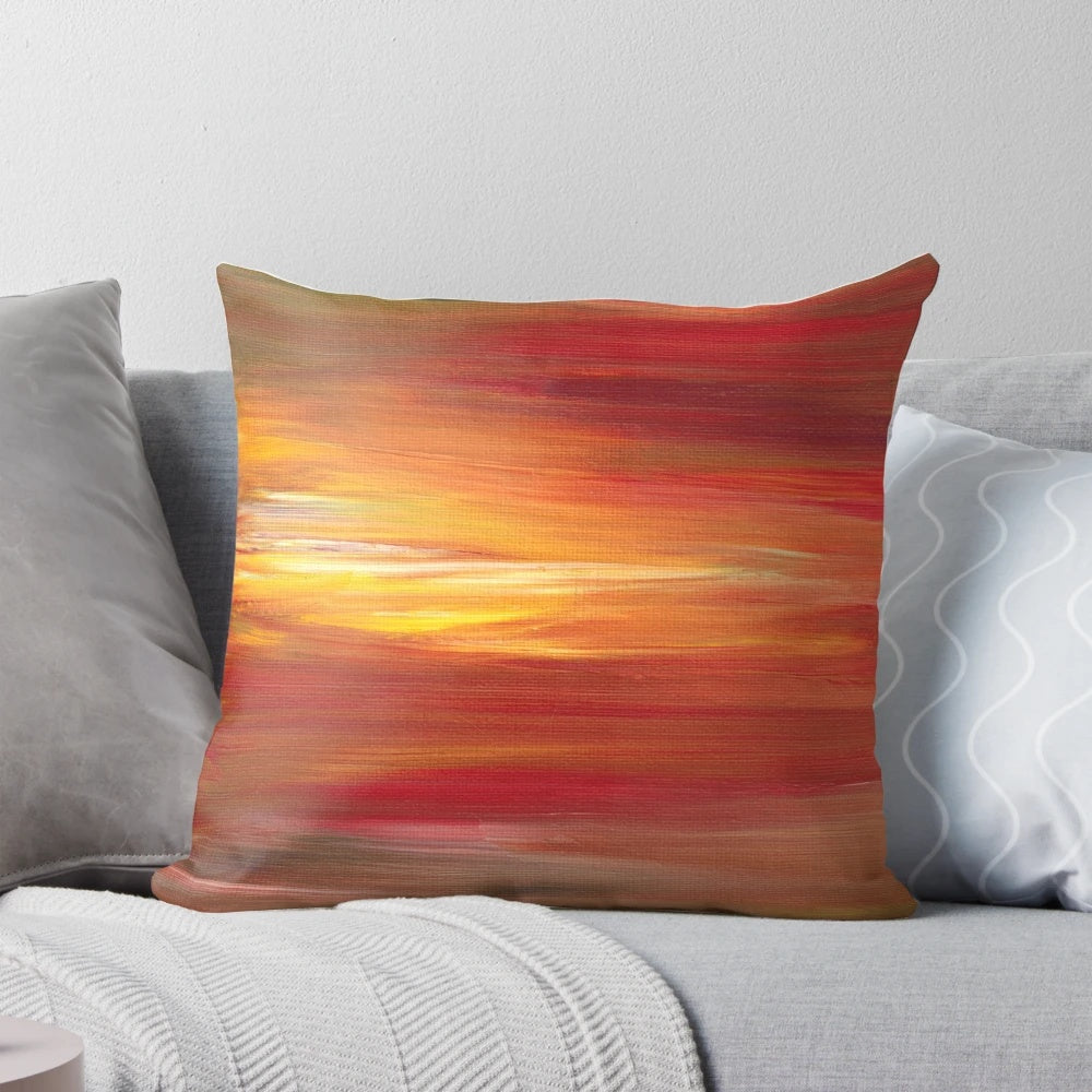 Colorful abstract ombre painting in shades of red, yellow, and black on a decorative throw pillow.