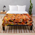 Orange abstract plush blanket with a vibrant, modern pattern