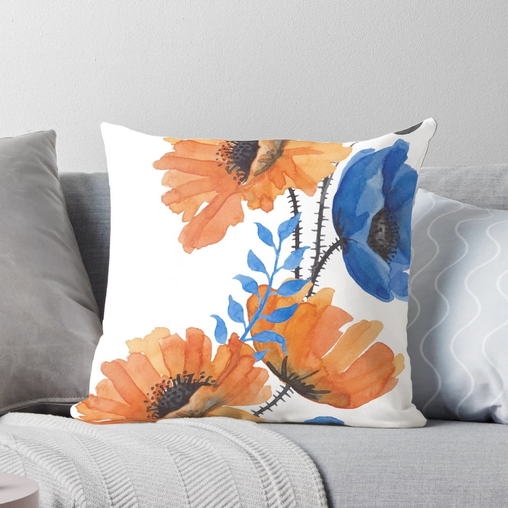A colorful decorative pillow featuring an eye-catching orange and blue poppy design, perfect for adding a touch of nature-inspired beauty to any room.