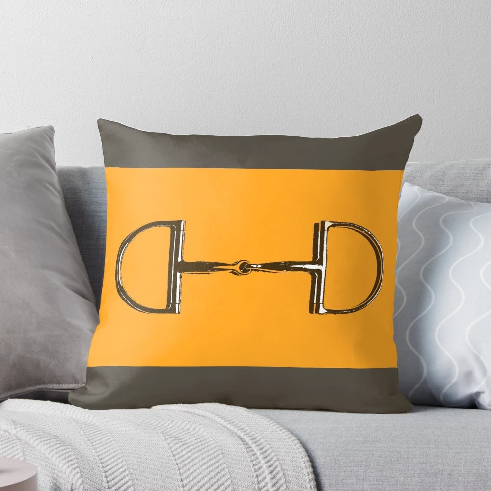Vibrant orange and taupe colored horse bit themed pillow