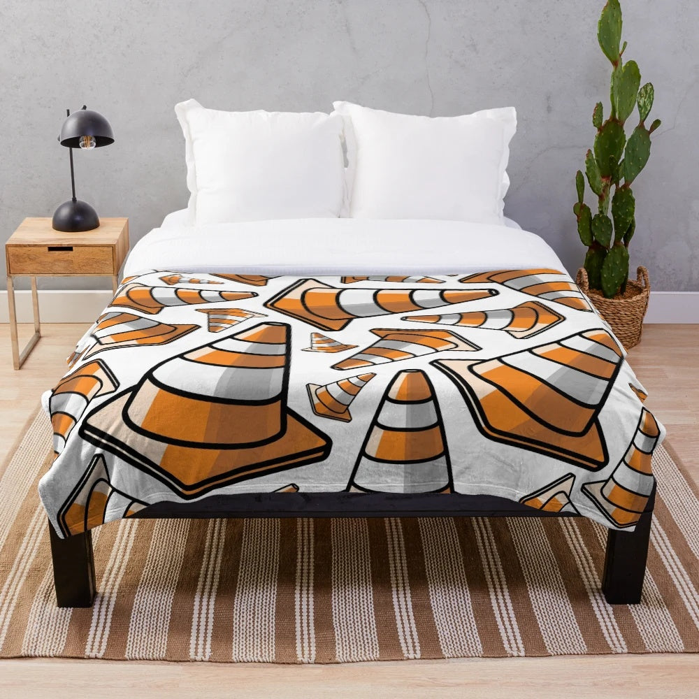 Plush blanket with a vibrant traffic cone pattern