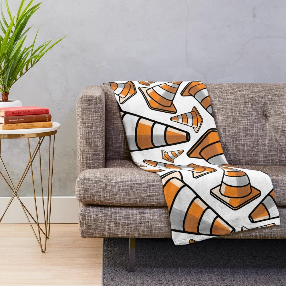 Plush blanket with a vibrant traffic cone pattern