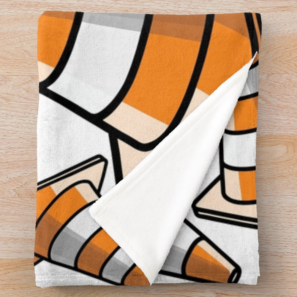 Plush blanket with a vibrant traffic cone pattern