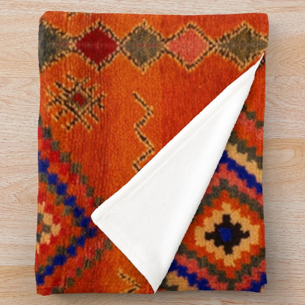 Orange Moroccan rug inspired plush blanket with abstract pattern