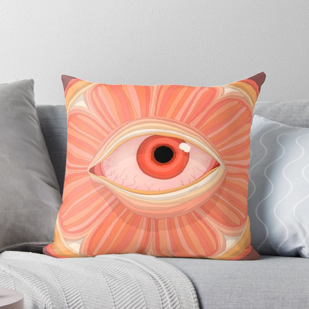 A vibrant orange pillow with a citrusy and fruity design, perfect for soothing bloodshot eyes.