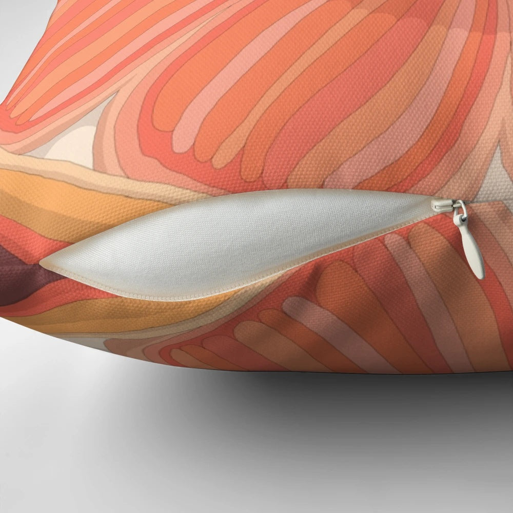 A vibrant orange pillow with a citrusy and fruity design, perfect for soothing bloodshot eyes.