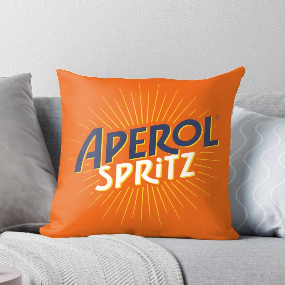 Vibrant orange pillow with Aperol spritz cocktail design