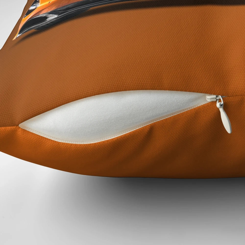 Vibrant orange pillow featuring a Mclaren P1 inspired formula 1 style graphic design.