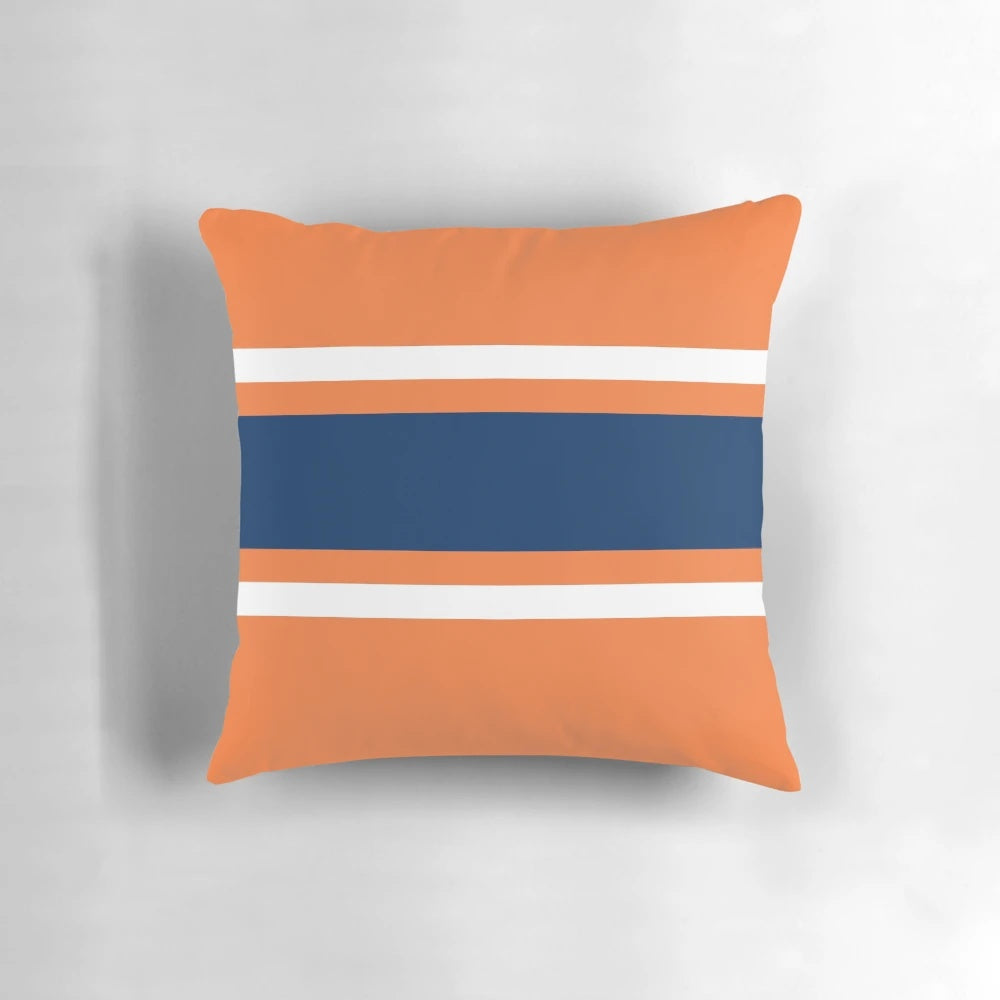 Orange, white, and navy power stripe pillow with sporty design